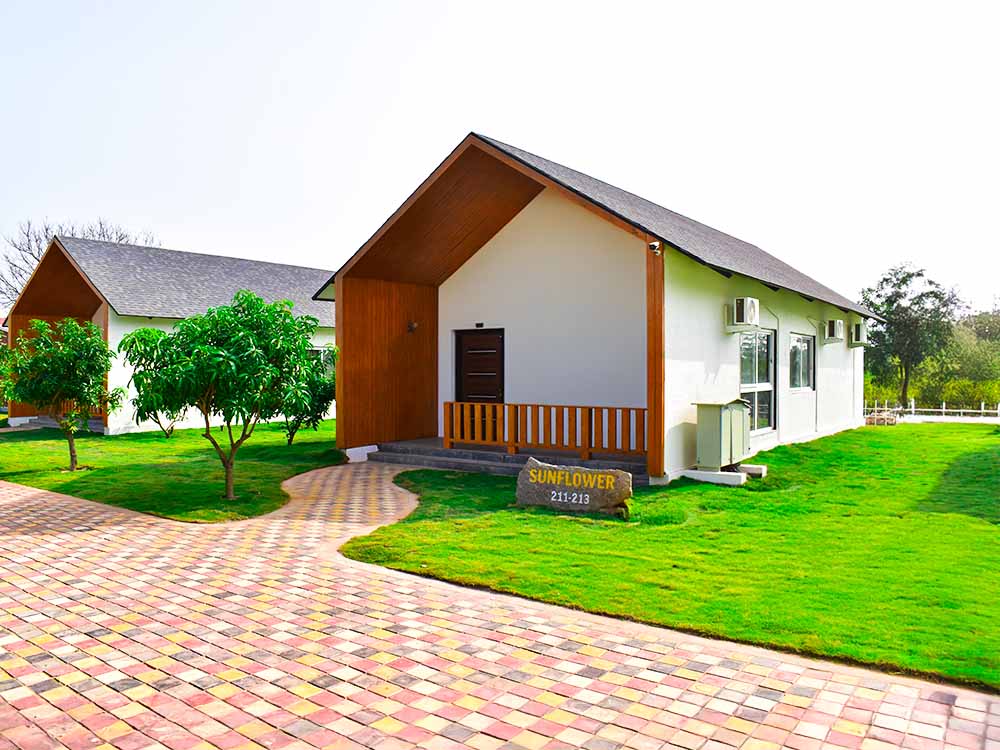 Sunflower luxury suite cottage at Go Ranch Resort near Hyderabad – spacious stay with private sit-out, ideal for families and special occasions.